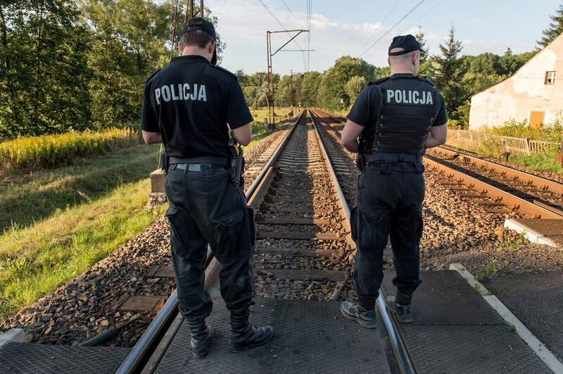 Police officers patrolling the railway tracks on a line between Walbrzych and Wroclaw, in Walbrzych’s suburbs, Poland. Maciej Kulczynski/EPA