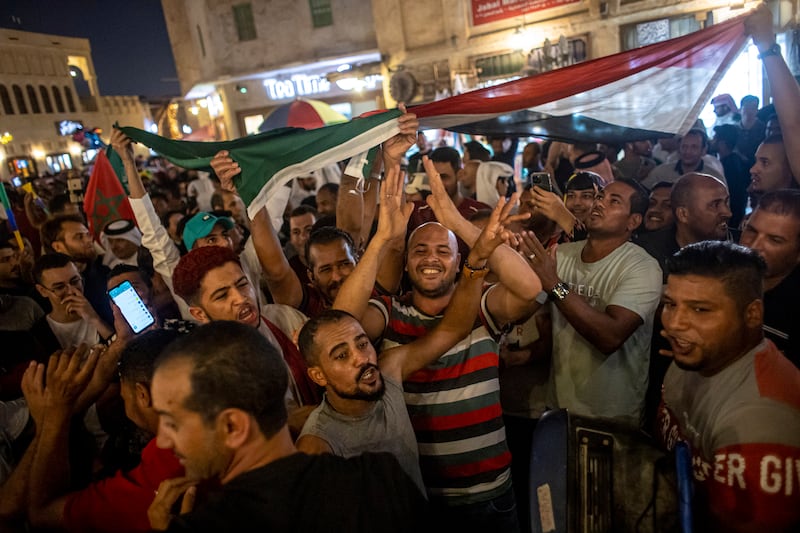 Fans with Saudi Arabian flags at Souq Waqif market during Saudi Arabia's win over Argentina in the World Cup. EPA
