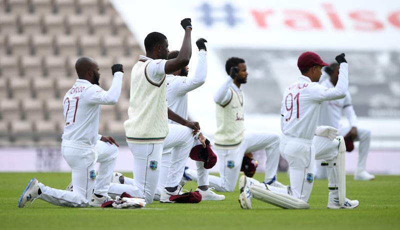 West Indies captain Jason Holder and his teammates take a knee during day one of the first #RaiseTheBat Test match against England at The Ageas Bowl in Southampton on Wednesday. Getty