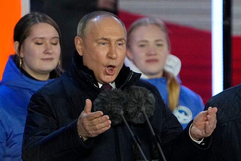 Vladimir Putin speaks at a concert marking his latest presidential election victory and the 10th anniversary of the annexation of Crimea. AP