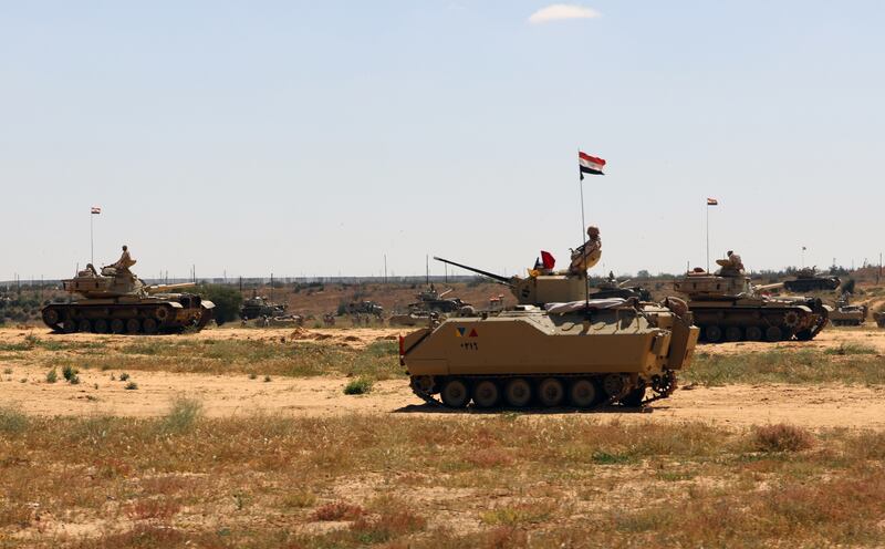 Egyptian armored vehicles near the border crossing between Egypt and Gaza, in March 2024. EPA