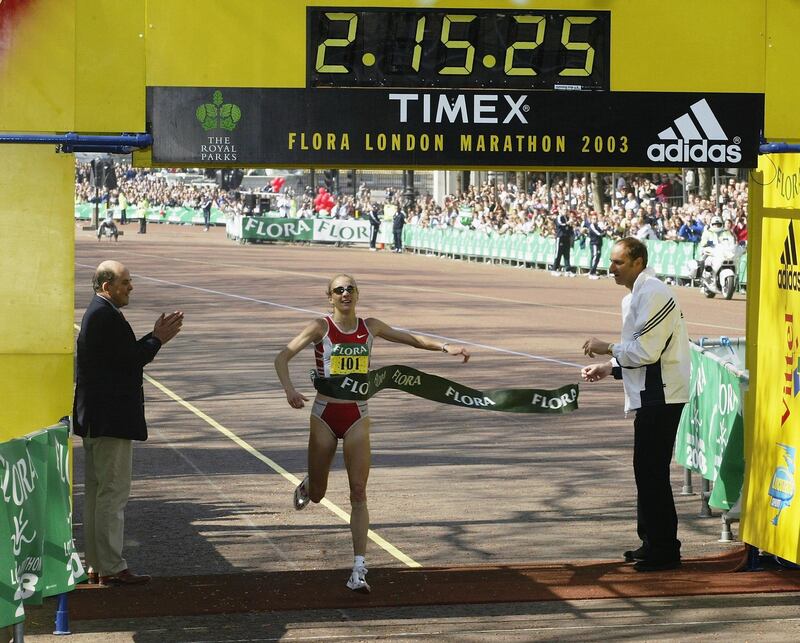 LONDON - APRIL 13:   Paula Radcliffe of Great Britain crosses the line to win the 2003 Flora London Marathon on April 13, 2003 at the Mall in London, England. (Photo by Warren Little/Getty Images)