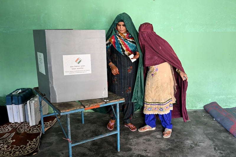 Women vote at a polling station in Kairana, Uttar Pradesh, during the first phase of India's general election on Friday. AFP
