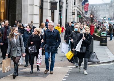 Britons have been warned there may be more restrictions on the cards before Christmas, Pictured, shoppers in London's Regent Street hurry about to buy the last few items before Christmas. Photo: PA