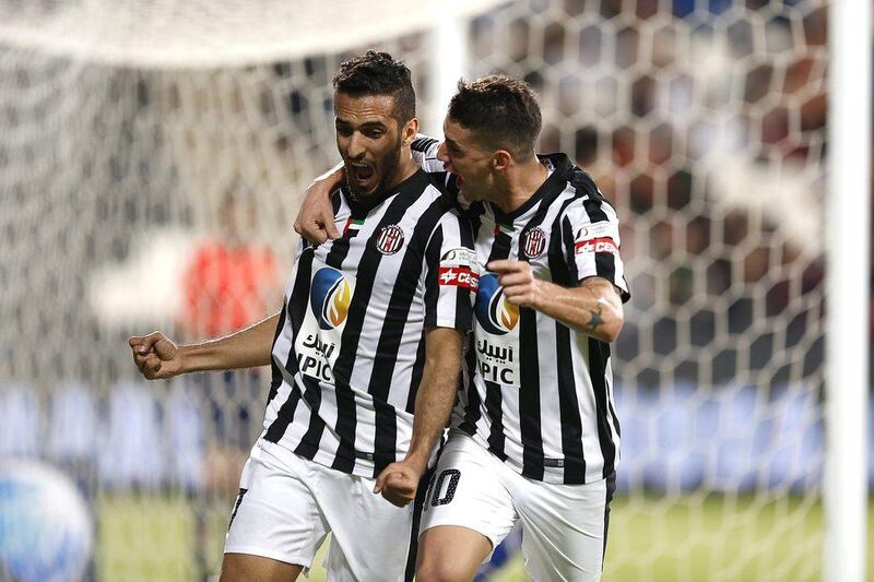 Ali Mabkhout of Al Jazira (left) celebrates scoring a goal during the Arabian Gulf League football match between Al Jazira and Al Nasr, at Mohammed bin Zayed Stadium, Abu Dhabi. 22 November 2015. Photo: Al Ittihad 