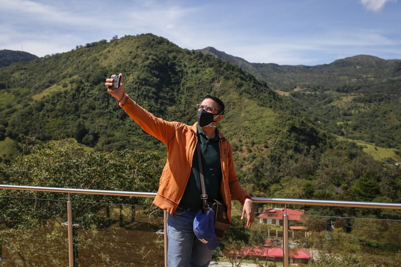 A tourist takes a selfie in Colombia, which is one of only seven countries currently on the red list. Getty Images