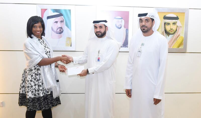 A British tourist is honoured by the Roads and Transport Authority for her part in combating illegal taxi services in Dubai after she was exploited by an unlicensed driver. Courtesy RTA