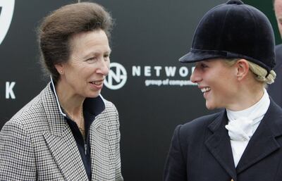 GATCOMBE, ENGLAND - SEPTEMBER 17: 2006 World Champion, Zara Phillips shares a joke with her mother, Princess Anne, Princess Royal as she is presented with an award during the Gatcombe Horse Trials August 17, 2006, Gatcombe, England. (Photo by Matt Cardy/Getty Images)  