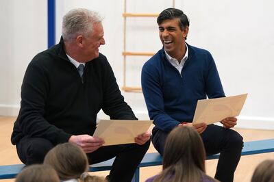 Rishi Sunak with Lee Anderson during a visit to a school. The Prime Minister said the MP had made some unacceptable comments. PA