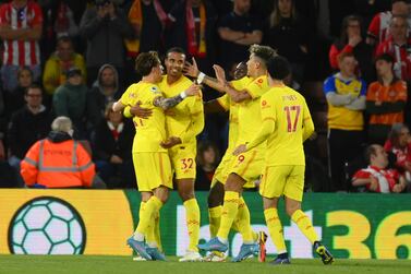 SOUTHAMPTON, ENGLAND - MAY 17: Joel Matip of Liverpool celebrates with team mates after scoring their sides second goal during the Premier League match between Southampton and Liverpool at St Mary's Stadium on May 17, 2022 in Southampton, England. (Photo by Mike Hewitt / Getty Images)