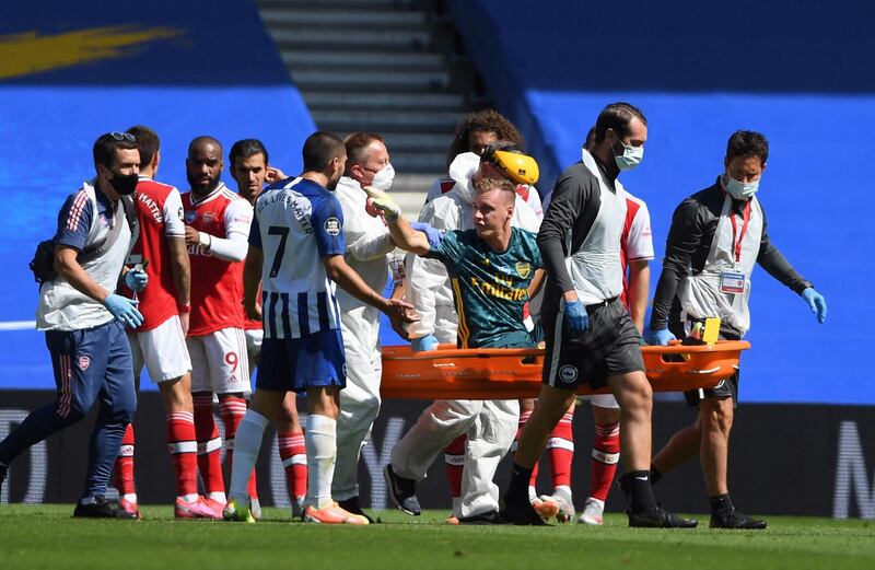Arsenal goalkeeper Bernd Leno, on stretcher, remonstrates with Brighton's Neal Maupay after the keeper was injured during the Premier League match at the American Express Community Stadium on Saturday. AFP
