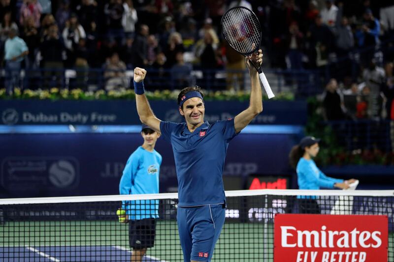 Switzerland's Roger Federer celebrates after winning the final match at the ATP Dubai Tennis Championship in the Gulf emirate of Dubai on March 2, 2019. Roger Federer won his 100th career title when he defeated Greece's Stefanos Tsitsipas 6-4, 6-4 in the final of the Dubai Championships. / AFP / Karim Sahib
