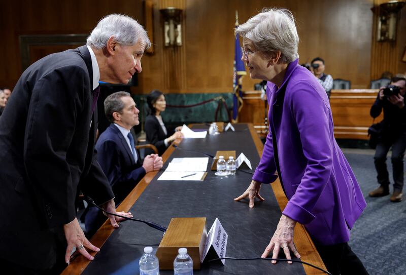 US senator Elizabeth Warren speaks to Federal Deposit Insurance Corporation chairman Martin J. Gruenberg before a committee hearing on 'Recent Bank Failures and the Federal Regulatory Response', in Washington. Reuters