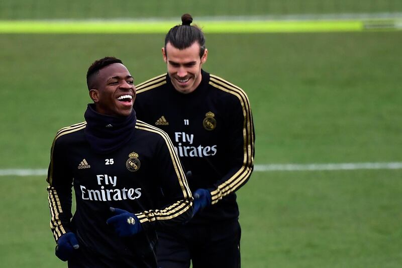 Real Madrid's Brazilian forward Vinicius Junior and Welsh forward Gareth Bale laugh during a training session. AFP