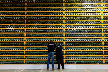 Technicians inspecting Bitcoin mining at Bitfarms in Quebec. AFP