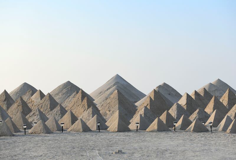 A land art installation of 448 hand-sculpted pyramids by Jim Denevan, part of a Public Art Abu Dhabi initiative on Fahid Island, Abu Dhabi. Khushnum Bhandari / The National
