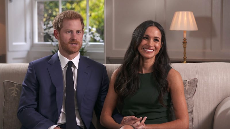 In this photo taken from video Britain's Prince Harry and Meghan Markle talk about their engagement during an interview in London, Monday, Nov. 27, 2017. It was announced Monday that Prince Harry, fifth in line for the British throne, will marry American actress Meghan Markle in the spring, confirming months of rumors. (Pool via AP)