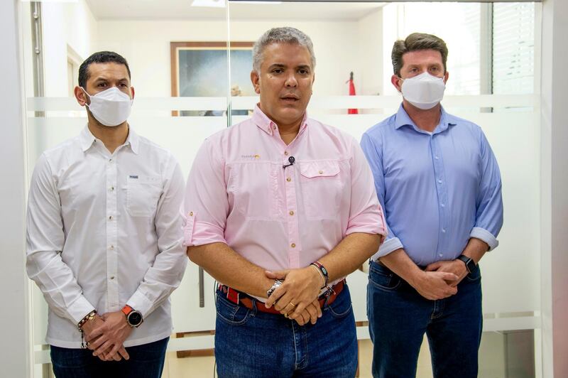 In this photo released by Colombia's Presidency, President Ivan Duque speaks, flanked by Interior Minster Daniel Palacios and Defense Minister Diego Molano, in Cucuta, Colombia. AP Photo