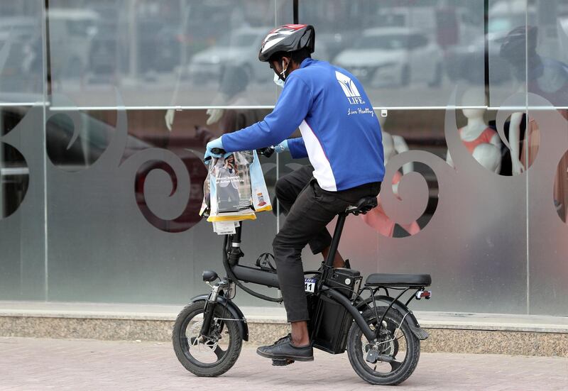 Dubai, United Arab Emirates - Reporter: N/A: A Life pharmacy worker makes his deliveries in Al Barsha. Monday, March 30th, 2020. Dubai. Chris Whiteoak / The National