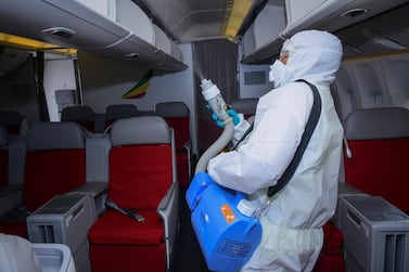 A worker disinfects the cabin of an Ethiopian Airlines aircraft at Bole International Airport in Addis Ababa, Ethiopia. The deadly coronavirus Covid-19 has hit the global aviation industry hard. EPA