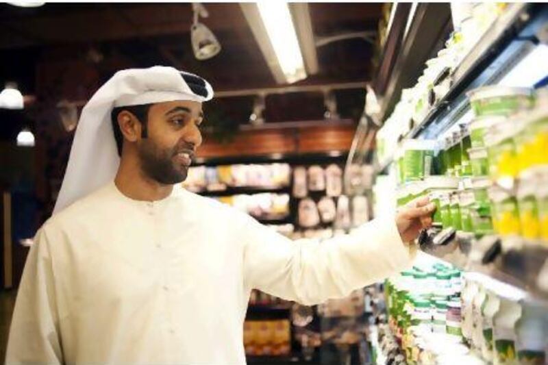 Rashid Aljari shops for goat milk to feed his lactose intolerant son at The Organic Foods & Café in Dubai Mall.