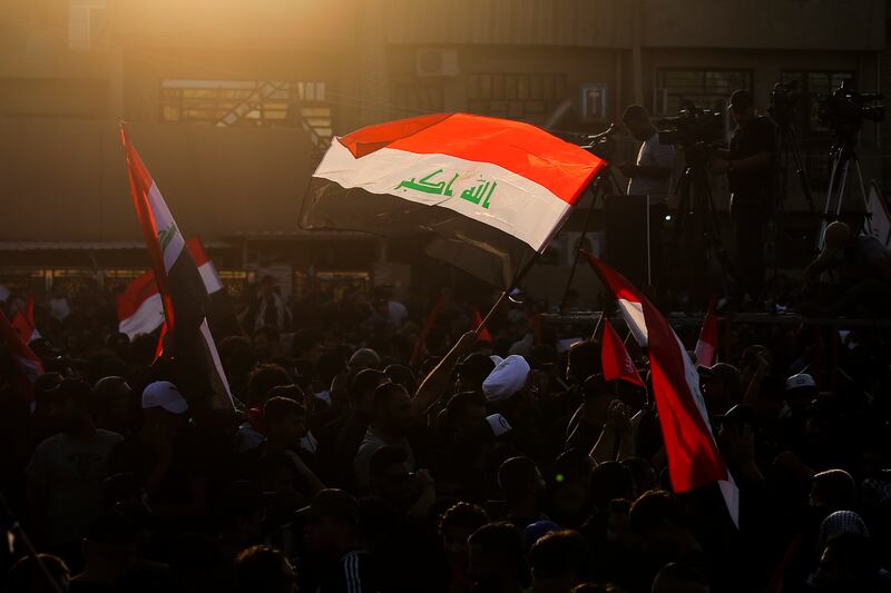 Supporters of Iraq's Co-ordination Framework political bloc attend a rally to denounce their rivals, followers of influential cleric Moqtada Al Sadr, in Baghdad on August 12, 2022. AFP