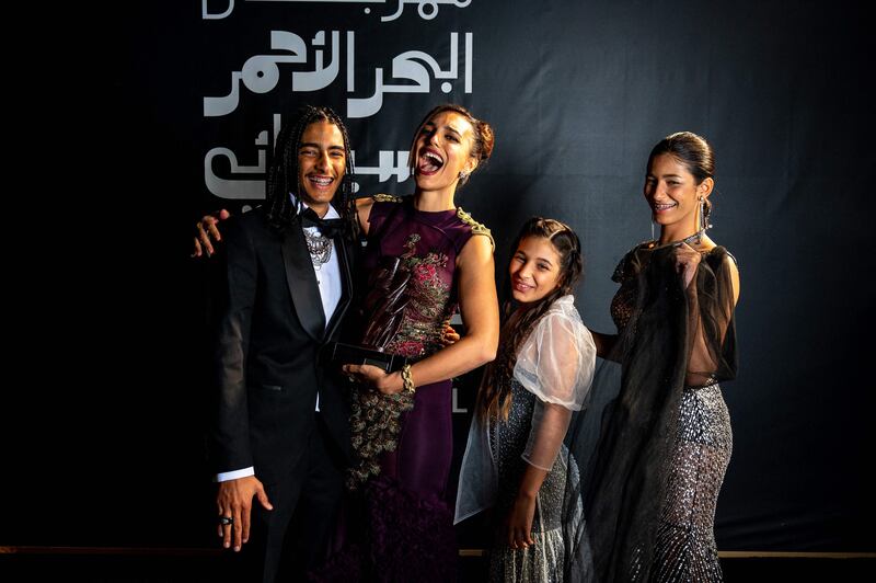 US-Egyptian film director Dina Amer, second from left; and her teammates - from left, Djino Grimaudo, Ilona Grimaudo and Lorenza Grimaudo pose for a photo after the closing ceremony. Photo: Red Sea International Film Festival / AFP