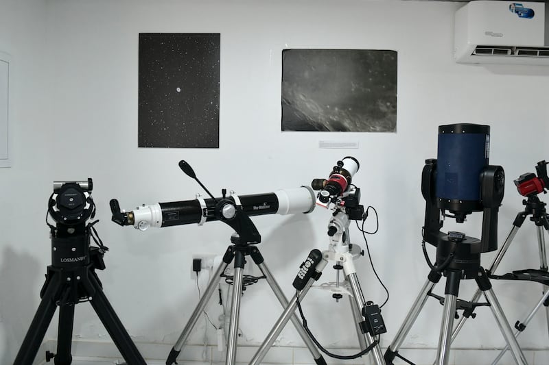 Various mounts and different types of telescopes in the lecture hall 
