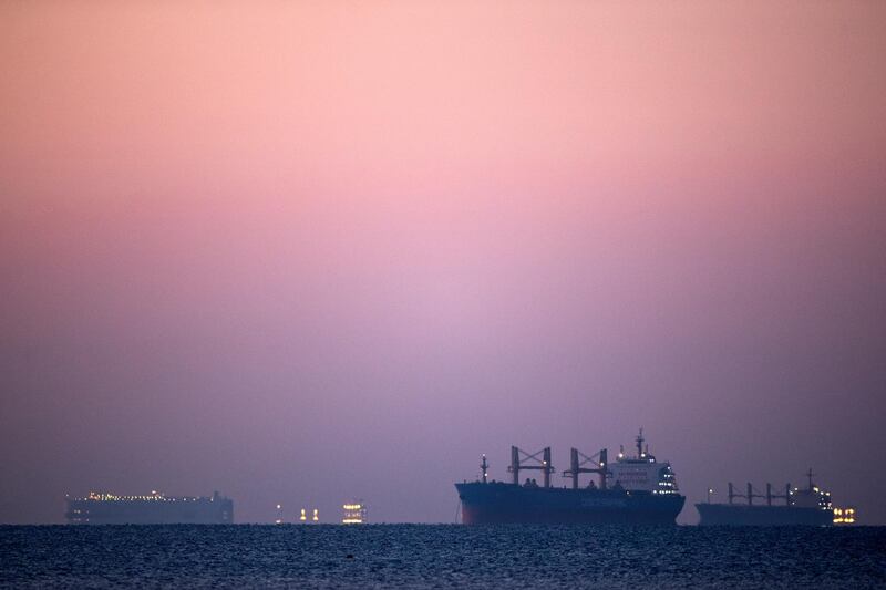 SUEZ, EGYPT - MARCH 29: Ships and boats are seen at the entrance of Suez Canal on March 29, 2021 in Suez, Egypt. Work continues to free the Ever Given, a huge container ship stuck sideways in Egypt's Suez Canal. The ship ran aground in the canal on March 23, after being caught in 40-knot winds. Dredgers have been working on the port side of the ship in an attempt to remove sand and mud and dislodge the vessel. The Suez Canal is one of the worlds busiest shipping lanes and the blockage has created a backlog of vessels at either end, raising concerns over the impact the accident will have on global shipping and supply chains. (Photo by Mahmoud Khaled/Getty Images)