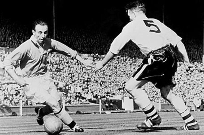 Blackpool's Stanley Matthews, left, known as the "Wizard of Dribble", takes on the Bolton defence in the 1953 FA Cup final. The winger helped his side battle back from 3-1 down to win 4-3 in what would later be known as the "Matthews Final".