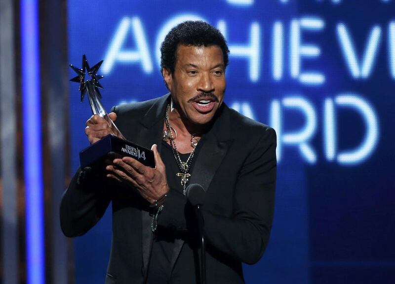 Lionel Richie accepts the lifetime achievement award during the 2014 BET Awards. Mario Anzuoni / Reuters