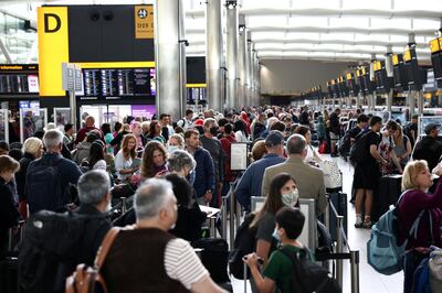 Passengers queue inside the departures terminal of Terminal 2 at Heathrow Airport during the summer. Reuters 