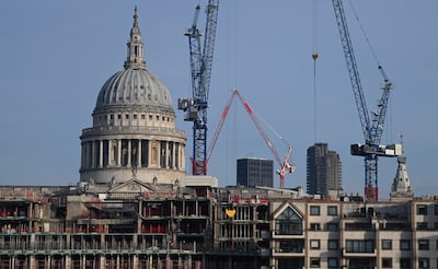 Building work near St Paul's Cathedral in London. UK construction output fell by 0.2 per cent in November, following a year of rising interest rates. EPA