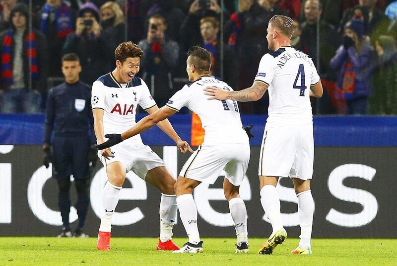 Son Heung-min of Tottenham Hotspur celebrates with his teammates Erik Lamela, centre, and Toby Alderweireld, right, after scoring. Maxim Shipenkov / EPA