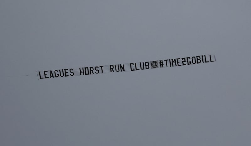 A plane flies over the stadium displaying a message in protest against the Everton owner and board. Reuters