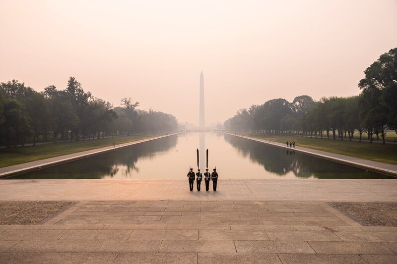 US marines prepare for a parade near the Lincoln Memorial in Washington, under a sky clouded by smoke from wildfires in Canada. EPA
