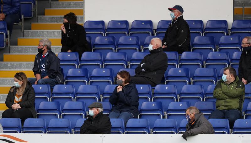 Fans look on as 300 fans are allowed in to the stadium following the outbreak of the coronavirus disease. REUTERS