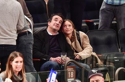 NEW YORK, NY - NOVEMBER 09:  (EXCLUSIVE COVERAGE PREMIUM RATES APPLY) Olivier Sarkozy and Mary-Kate Olsen attend New York Knicks vs Brooklyn Nets game at Madison Square Garden on November 9, 2016 in New York City.  (Photo by James Devaney/GC Images)