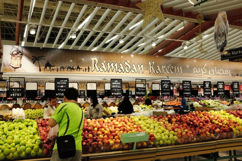 Customers browse produce at a mall during Ramadan. ( Jaime Puebla / The National Newspaper ) 