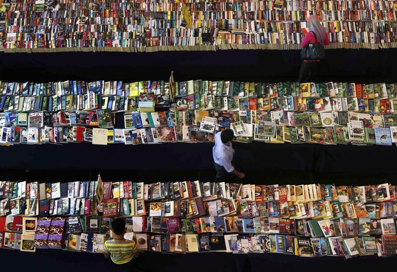 People browse books at a  stall in Petaling Jaya, outside Kuala Lumpur. Samsul Said / Reuters