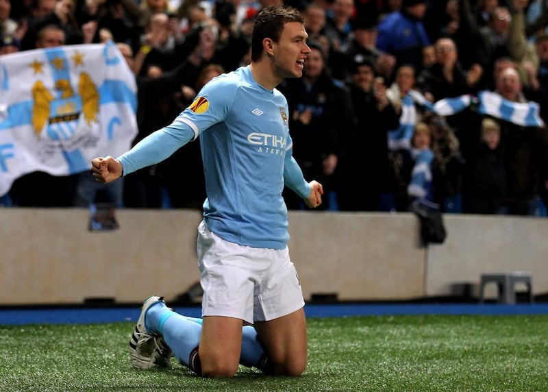 MANCHESTER, ENGLAND - FEBRUARY 24:  Edin Dzeko of City celebrates as he scores the opening goal during the UEFA Europa League round of 32 second leg match between Manchester City and Aris Saloniki at City of Manchester Stadium on February 24, 2011 in Manchester, England.  (Photo by Alex Livesey/Getty Images)