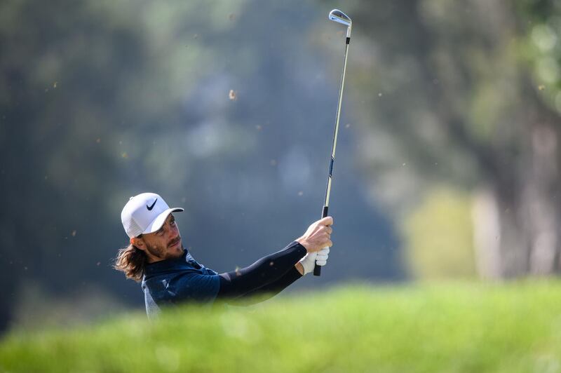 Tommy Fleetwood of England hits a shot during round one of the Hong Kong Open at the Hong Kong Golf Club on November 23, 2017. / AFP PHOTO / Anthony WALLACE