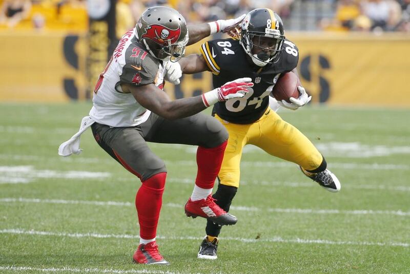 Antonio Brown, right, leads the NFL in receiving yards and receptions. Gene J Puskar / AP