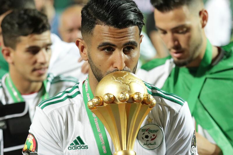 Algeria's Riyad Mahrez kisses the Africa Cup of Nations trophy. AP