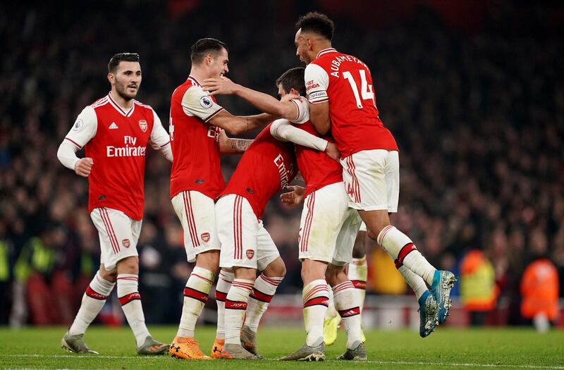 Arsenal's Sokratis Papastathopoulos celebrates scoring the second goal. PA