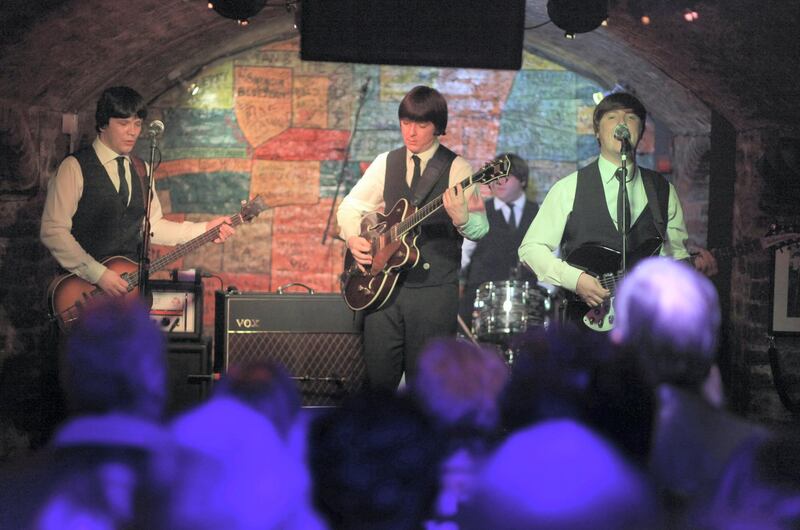 LIVERPOOL, ENGLAND - FEBRUARY 09:  Tribute band the Mersey Beatles play on the stage of the famous Cavern Club on the 50th anniversary of the first time The Beatles played at the basement club on February 9, 2011 in Liverpool, England. The fab four took to the stage on 9 February 1961, 50 years ago today. Fans from around the world celebrated the occasion by watching tribute bands and taking in the atmosphere of the Mathew Street Cavern Quarter in the heart of Liverpool.  (Photo by Christopher Furlong/Getty Images)