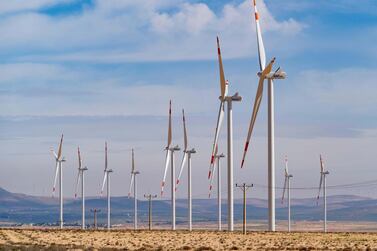 Wind turbines at a wind farm beside King's Highway in Ma'an Governorate in Jordan. Alamy
