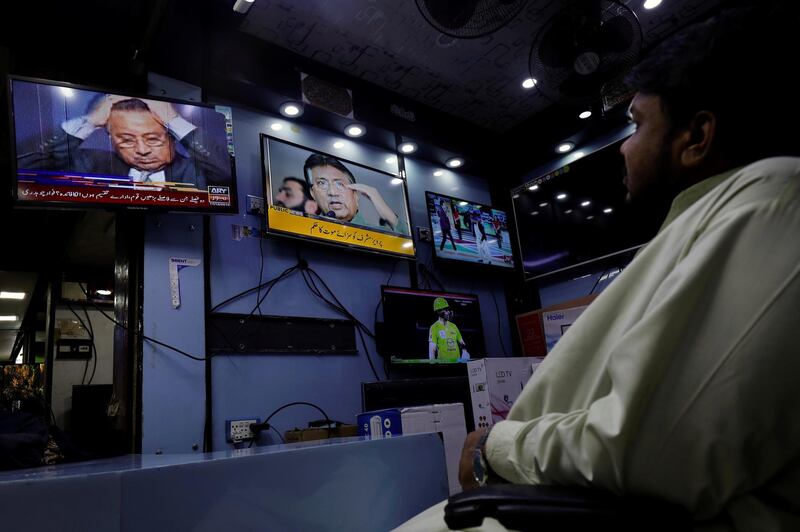 A shopkeeper observes screens displaying the news after Pakistani court sentenced former military ruler Pervez Musharraf to death on charges of high treason and subverting the constitution, at a shop in Karachi, Pakistan.  Reuters