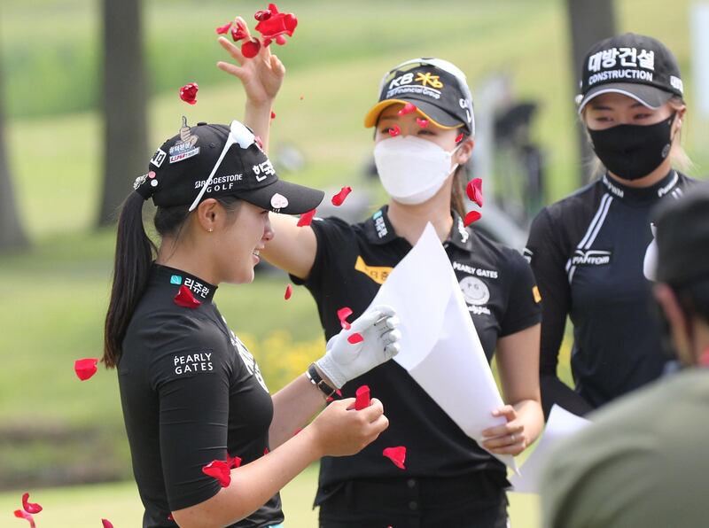 epa08427076 A handout photo made available by the KLPGA show Park Hyun-kyung (L) of South Korea celebrates after winning during the final round of the KLPGA Championship golf tournament at Lakewood Country Club in Yangju, South Korea, 17 May 2020. The tournament, Korea Ladies Professional Golf Association's (KLPGA) first major of the season, is running from 14 until 17 May 2020 under strict health measures amid the ongoing coronavirus COVID-19 pandemic.  EPA/PARK JUN-SEOK/ HANDOUT  HANDOUT EDITORIAL USE ONLY/NO SALES