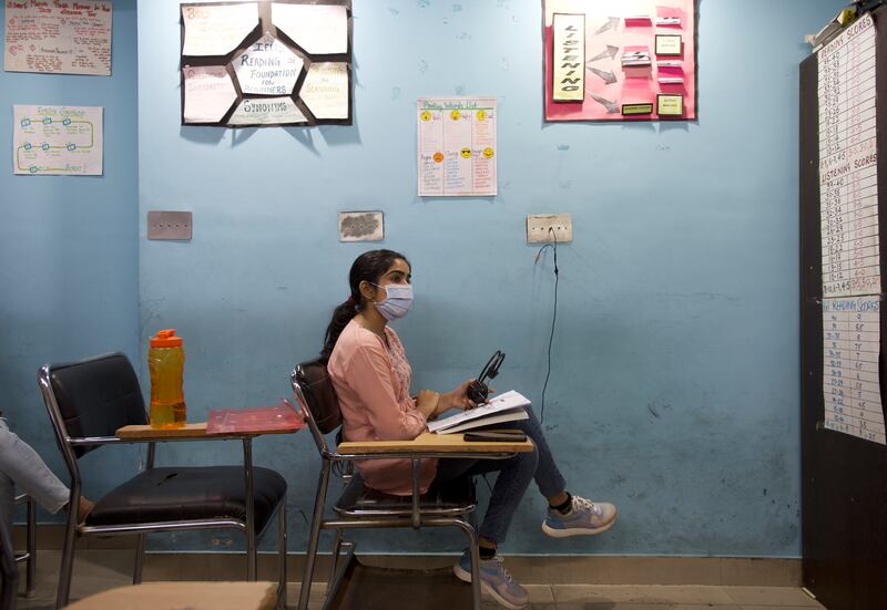 Ranjit Kaur, a microbiologist who works at a hospital in Jalandhar, is taking classes to prepare for mandatory English language exams so she can continue her studies in the West  